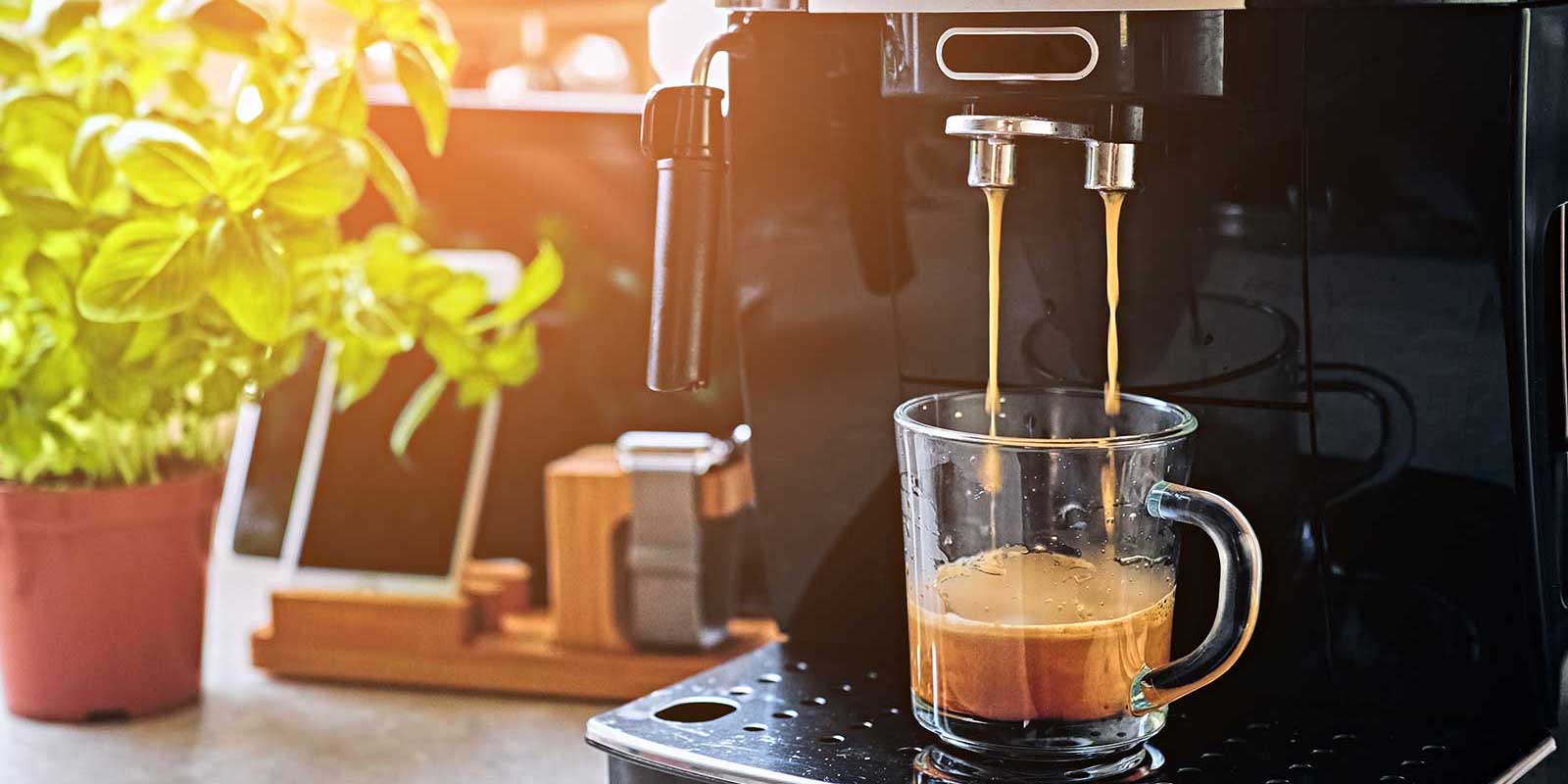 Coffee machine making a cup of coffee in the morning