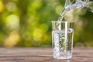 pouring water in glass