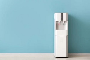 bottless water cooler on blue background