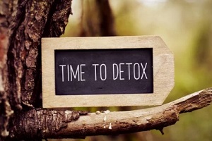time to detox on board placed on tree